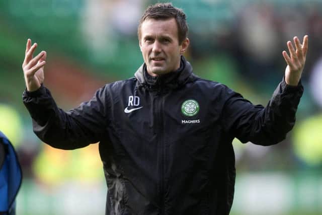 Celtic manager Ronny Deila celebrates at the end of the Scottish Premiership match at Celtic Park. Picture: PA