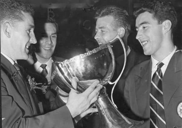 Dave MacKay, left, celebrates the League Cup victory with Hearts teammates in 1958. Picture: TSPL