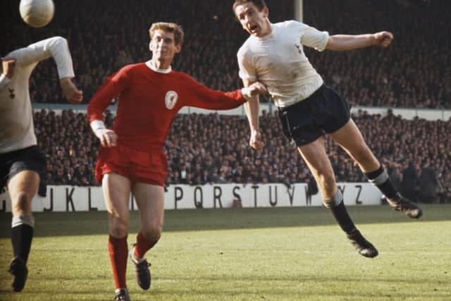 Dave Mackay, right, in action against Liverpool during a match circa 1968 at White Hart Lane. Picture: Getty