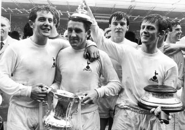 Dave Mackay is crowned by Jimmy Robertson (right) after Spurs' victory in the FA Cup Final. Picture: Getty