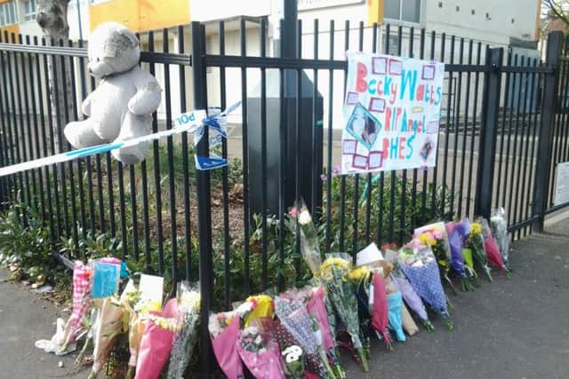 Floral tributes to Becky Watts left at Barton Court, in Barton Hill, Bristol. Picture: PA