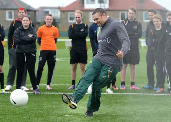 Bryan Habana on a visit to the Spartans Community Football Academy. Picture: Neil Hanna