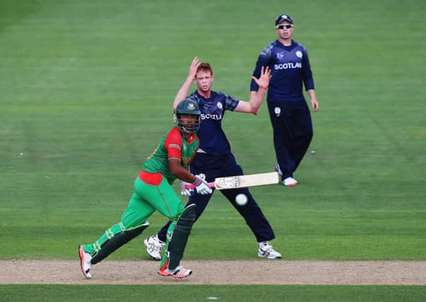 Tamim Iqbal of Bangladesh sets off for a run as Alasdair Evans of Scotland looks on. Picture: Getty