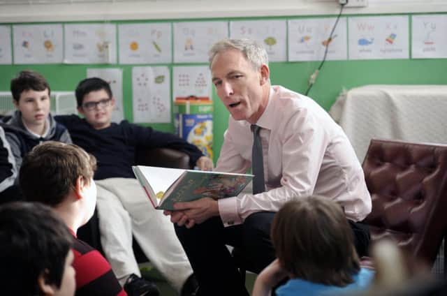 Jim Murphy visits a Glasgow primary school yesterday as civil war gripped his party. Picture: John Devlin
