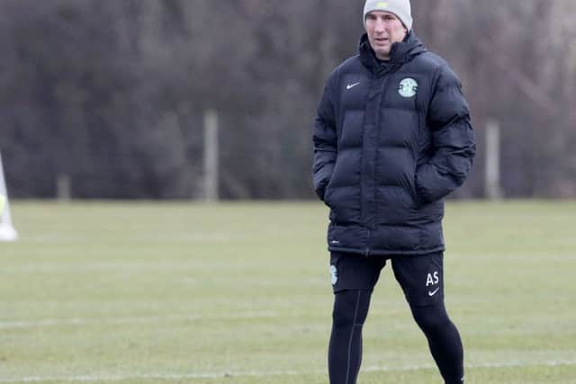 Hibernian manager Alan Stubbs keeps an eye on training. Picture: SNS