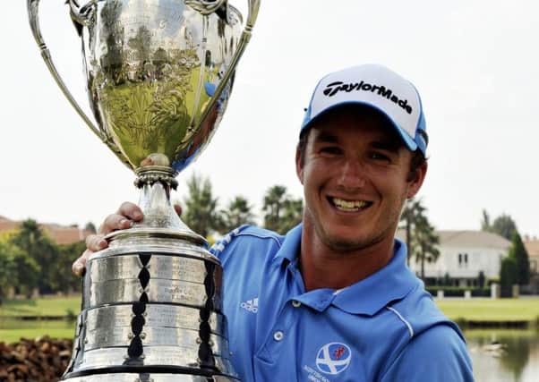 Daniel Young proudly shows off the South African Amateur Championship trophy. Picture: Catherine Kotze/SASPA