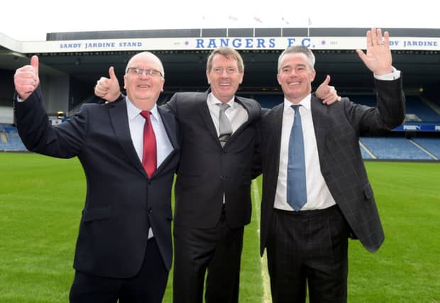 Dave King, centre, celebrates success at the club's EGM alongside John Gilligan, left, and Paul Murray. Picture: SNS