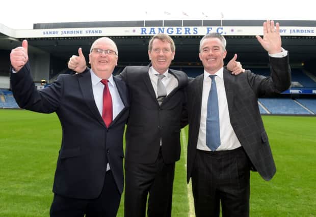 Dave King, centre, celebrates success at the club's EGM alongside John Gilligan, left, and Paul Murray. Picture: SNS