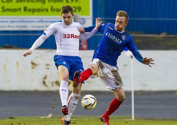 Rangers' Kyle Hutton and John Herron battle for the ball during the stalemate. Picture: SNS
