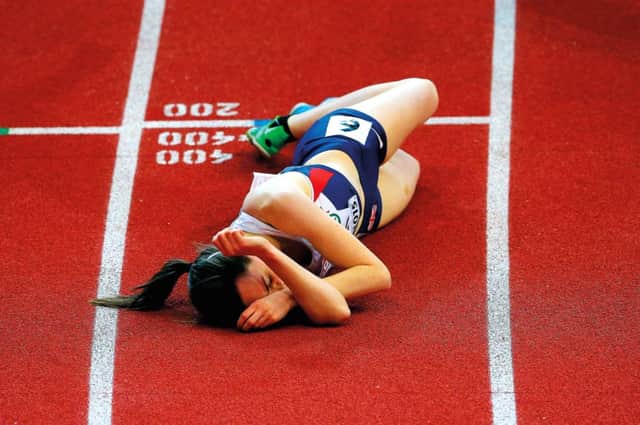 Laura Muir lies on the track after coming fourth in the 3000 metres final. Picture: Getty