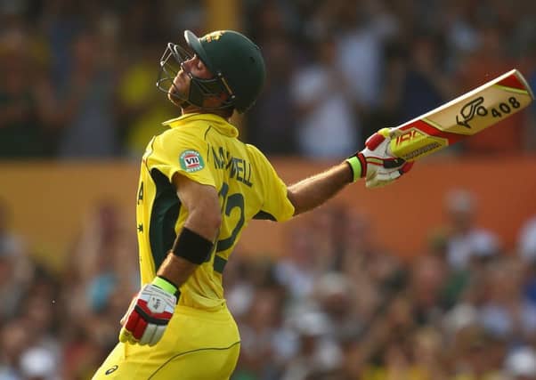 Australian batsman Glenn Maxwell celebrates his century during the co-hosts' 64-run victory. Picture: Getty