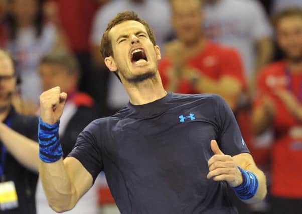 Andy Murray celebrates after winning his singles match. Picture: Ian Rutherford