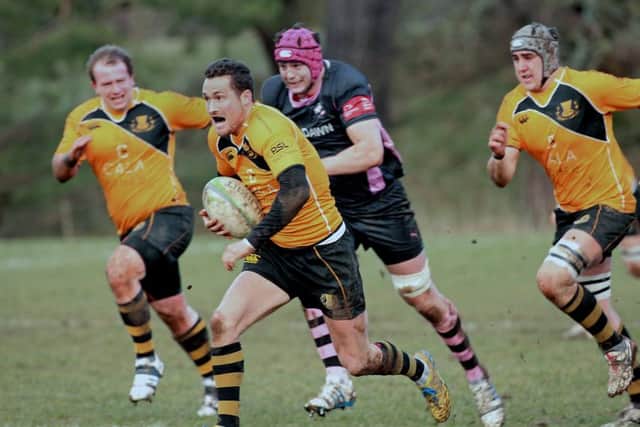 Currie stand-off James Semple, centre, breaks through the Ayr defence. Picture: Gordon Fraser
