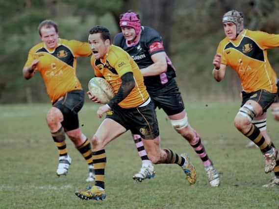 Currie stand-off James Semple, centre, breaks through the Ayr defence. Picture: Gordon Fraser