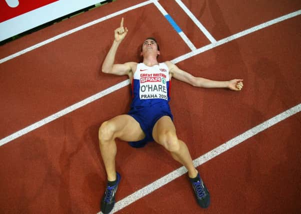 Chris O'Hare lies exhausted on the track after winning 1500m bronze. Picture: Getty