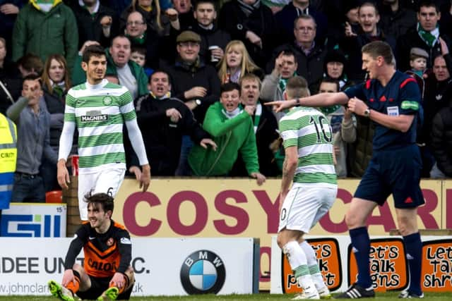 Aidan Connolly (bottom left) earns Dundee Utd a penalty after going down in the box. Picture: SNS