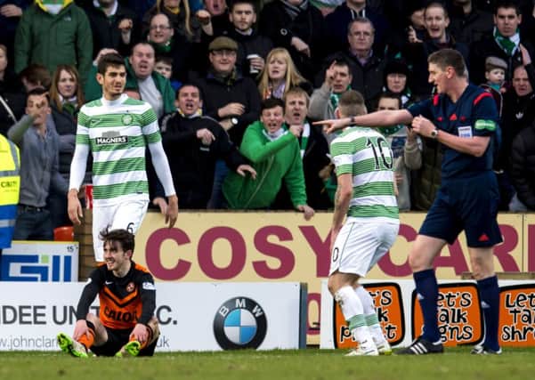 Aidan Connolly (bottom left) earns Dundee Utd a penalty after going down in the box. Picture: SNS