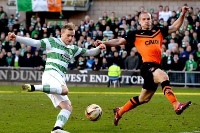 John Guidetti gets a shot away against Dundee United. Picture: SNS