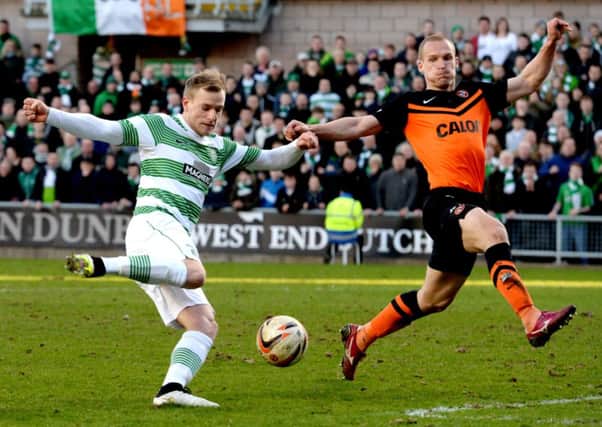 John Guidetti gets a shot away against Dundee United. Picture: SNS