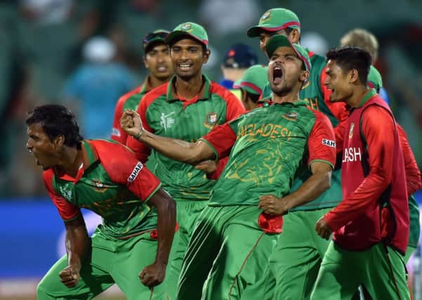 Rubel Hossain (L) and Mashrafe Mortaza lead the celebrations after Bangladesh dumped England out of the world cup. Picture: Getty