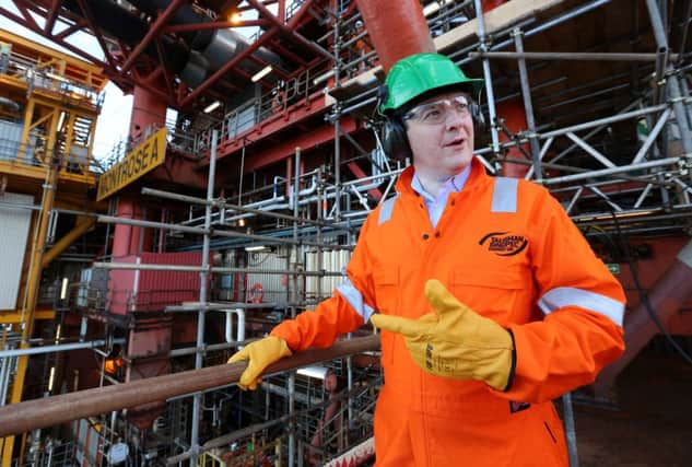 George Osborne on a North Sea platform yesterday. Picture: Getty
