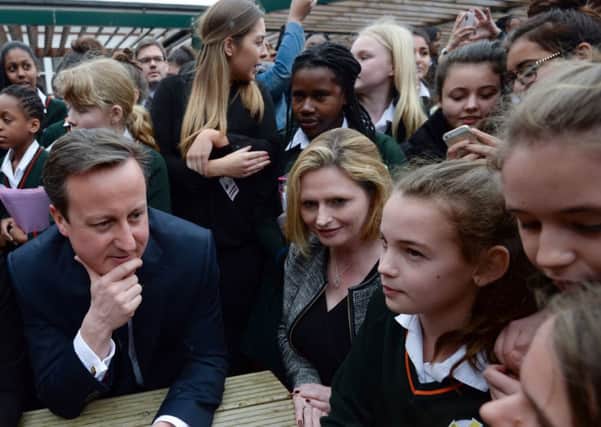 Prime Minister David Cameron meets pupils during a visit to the Green School For Girls in west London. Picture: PA
