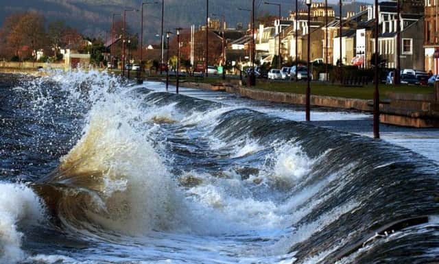 Waves crash on to the shoreline in Helensburgh. Picture: PA