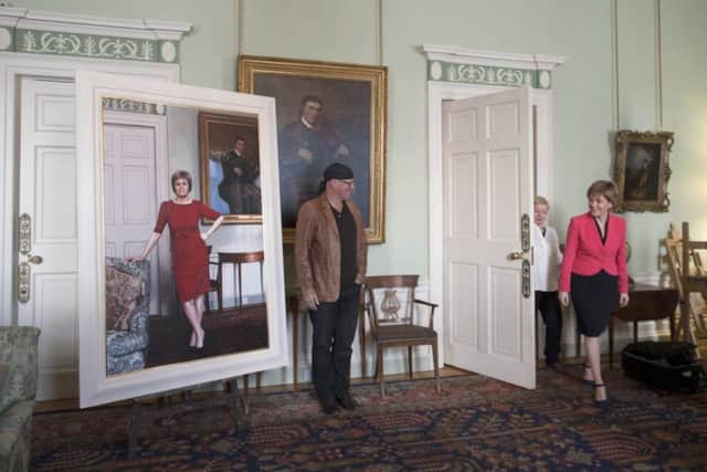 First Minister Nicola Sturgeon gets a look at her life-size portrait by artist Gerard M Burns at Bute House, Edinburgh. Picture: Jane Barlow