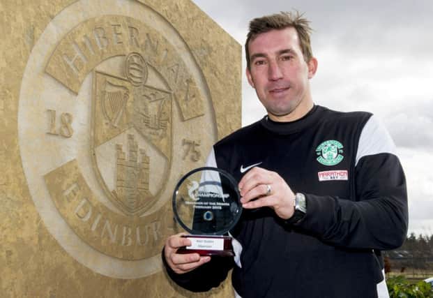 Hibs boss Alan Stubbs celebrates his manager of the month award. Picture: SNS
