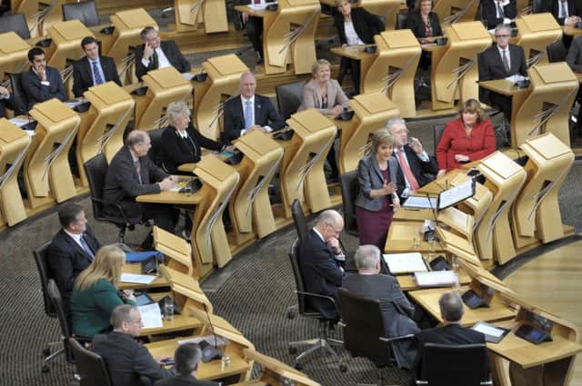 Nicola Sturgeon addresses Holyrood MSPs. Scottish Labour has claimed that SNP plans for full fiscal autonomy would leave Scotland with a six million pound budgetary black hole. Picture: Ian Rutherford
