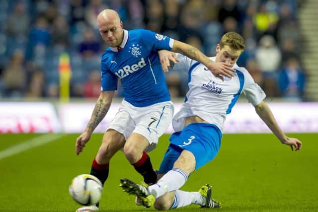 Rangers' Nicky Law, left, holds off Kevin Holt. Picture: SNS