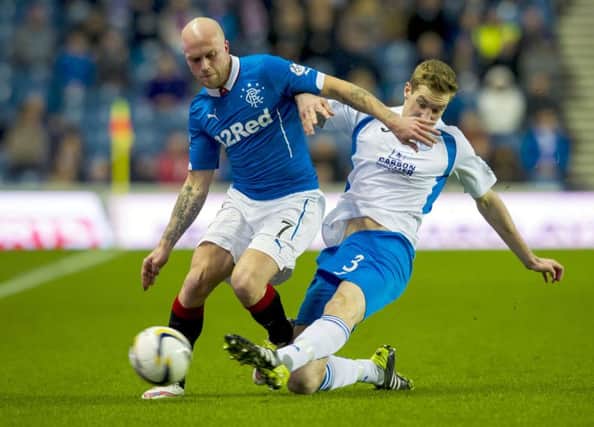 Rangers' Nicky Law, left, holds off Kevin Holt. Picture: SNS