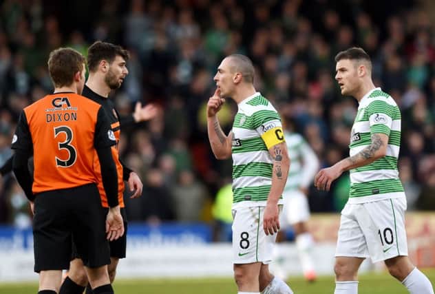 Scott Brown (centre) and Nadir Ciftci have words after a clash between the two. Picture: SNS