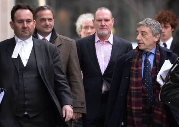 Former footballers Gary Mabbutt, second left, and Paul Gascoigne, second right, arrive at the High Court in London. Picture: PA
