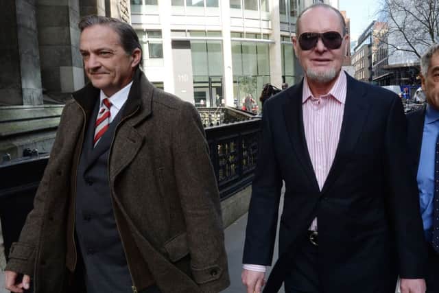 Former footballers Paul Gascoigne, right, and Gary Mabbutt leave the High Court in London. Picture: PA