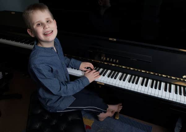 Ethan Loch from Dennyloanhead, near Falkirk, who is completely blind and a master on the piano. Picture: Hemedia