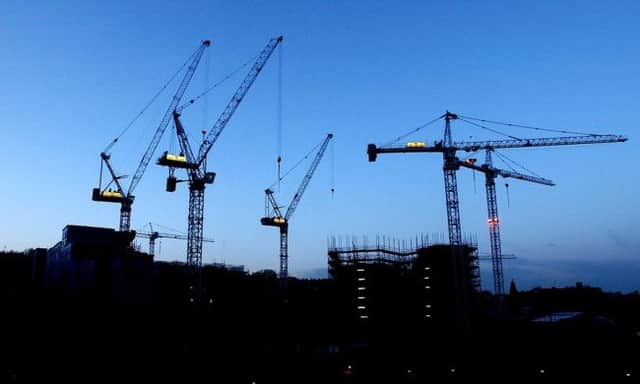 There's no surer sign of economic good times ahead than cranes at work in a city. Picture: Sean Bell