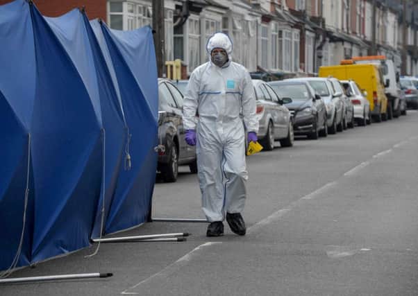Police investigations at the scene of the attack on Glynis Bensley in Smethwick last September. Picture: Hemedia