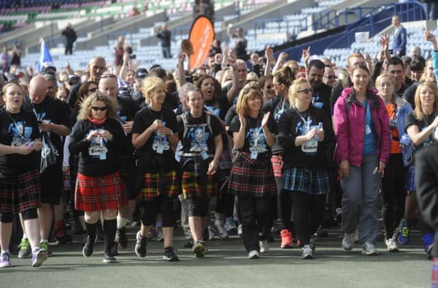 Participants in last year's Kiltwalk leave Murrayfield Stadium en route to Cramond. Picture: Greg Macvean