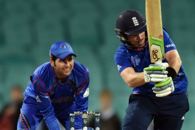Ian Bell hits the winning runs as Afghanistan wicketkeeper Afsar Zazai looks on. Picture: AFP/Getty