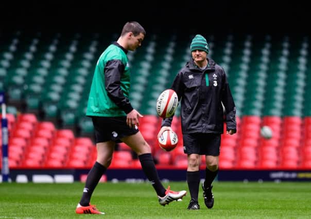 Ireland coach Joe Schmidt looks on as stand-off Johnny Sexton shows off his skills. Picture: Getty