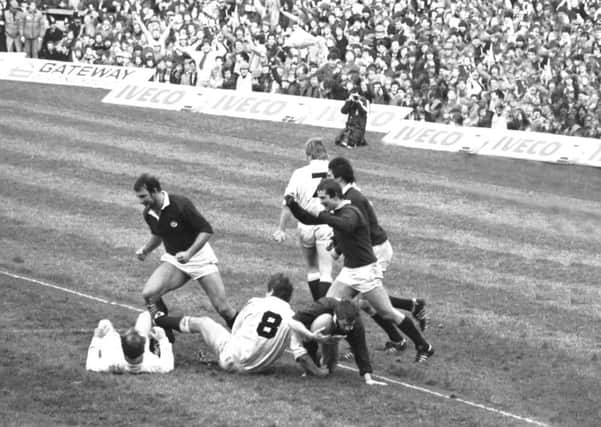 Team-mates celebrates Scottish captain Roy Laidlaw's try during the England v Scotland Calcutta Cup rugby international at Twickenham in March 1983. Picture: Hamish Campbell