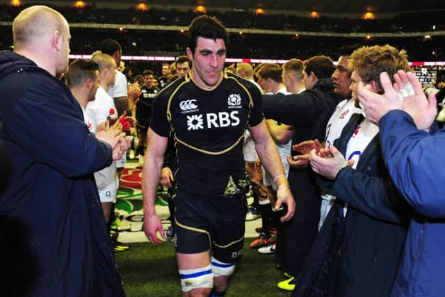 Kelly Brown leads Scotland off after defeat at Twickenham two years ago. Picture: Ian Rutherford