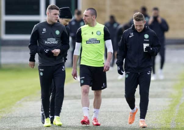 Brown, centre, with Anthony Stokes, left and Kris Commons ahead of training. Picture: SNS
