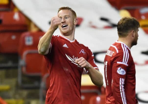 Aberdeen striker Adam Rooney celebrates after giving his side the lead. Picture: SNS