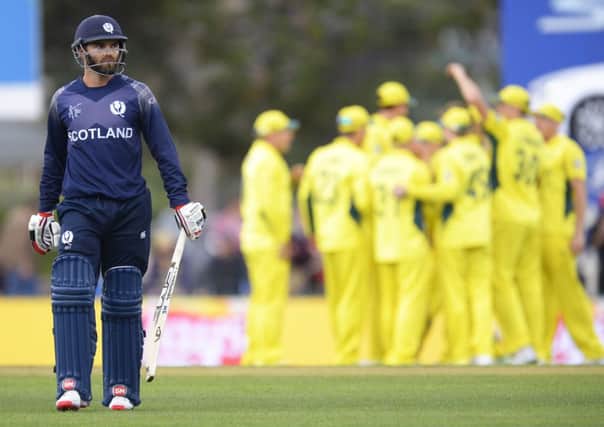 Preston Mommsen of Scotland leaves the field after being dismissed by Shane Watson of Australia. Picture: Getty