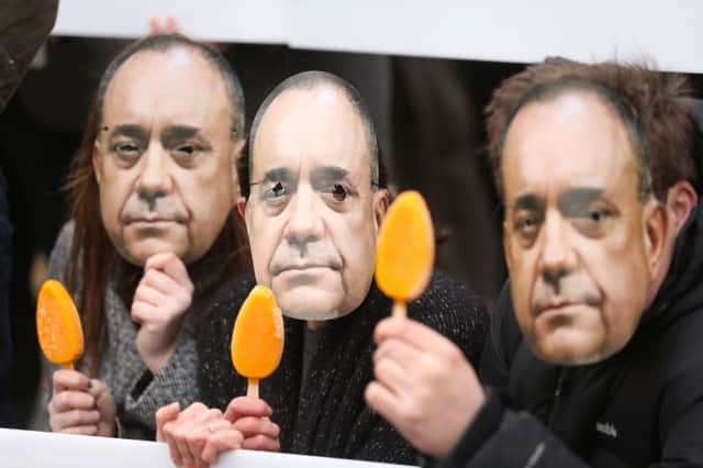Protesters donned Alex Salmond masks outside the ICC in Birmingham ahead of leader Ed Milibands speech. Picture: PA