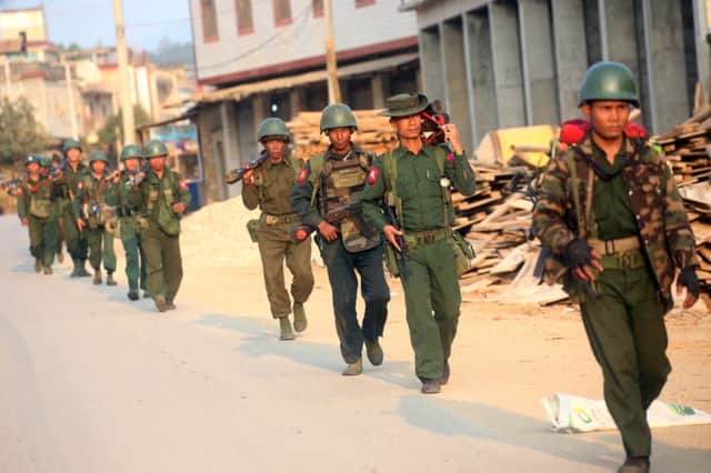 Myanmar soldiers patrol in Laukkai, the main city in Kokang. Picture: AFP/Getty