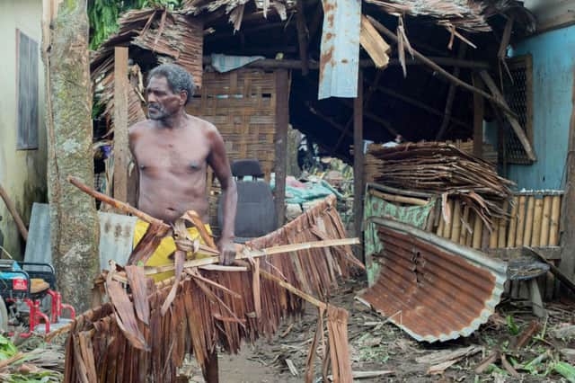 A resident at his damaged home in Port Vila. Picture: Getty