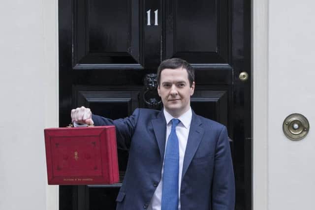 George Osborne outside No 11 with the celebrated Red Box. Picture: Getty
